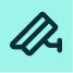 A simple line art icon of a security camera, angled to the right, on a light blue background.